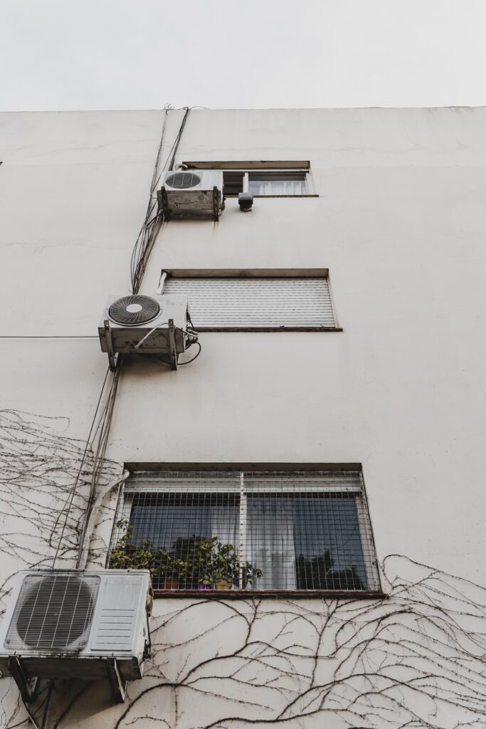 low angle city building with air conditioning units